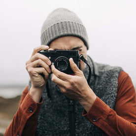 fit model taking a photo in The Headland Beanie in Warm Grey