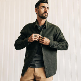 fit model adjusting The Ledge Shirt in Dark Forest Linen Tweed