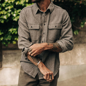 fit model adjusting sleeves of The Ledge Shirt in Granite Linen Tweed