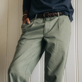 fit model with his hand in the pocket of The Matlow Pant in Dried Sage Pigment Herringbone