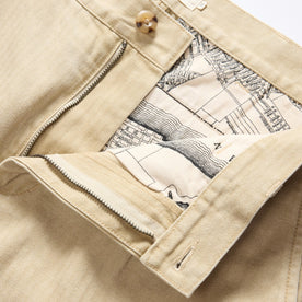 material shot of the waistband on The Matlow Pant in Light Khaki Pigment Herringbone