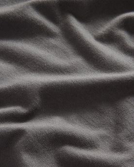 material shot of the fabric on The Organic Cotton Henley in Faded Black, Knits by Taylor Stitch