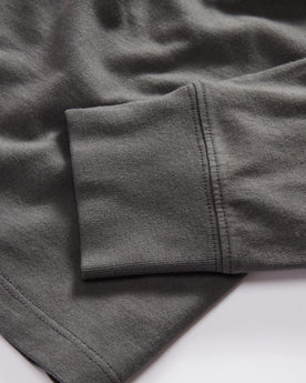 material shot of the sleeve on The Organic Cotton Henley in Faded Black, Knits by Taylor Stitch