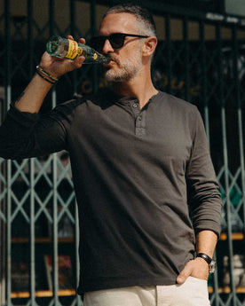 fit model wearing The Organic Cotton Henley in Faded Black, Knits by Taylor Stitch