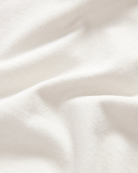 material shot of the fabric on The Organic Cotton Henley in Vintage White, Knits by Taylor Stitch