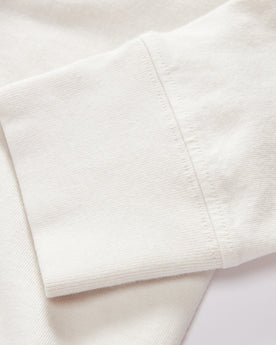 material shot of the sleeves on The Organic Cotton Henley in Vintage White, Knits by Taylor Stitch