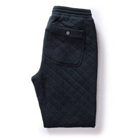 flatlay of The Quilted Jersey Pant in Midnight Heather, shown folded from the back