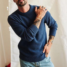 fit model showing off The Russell Sweater in Heather Blue