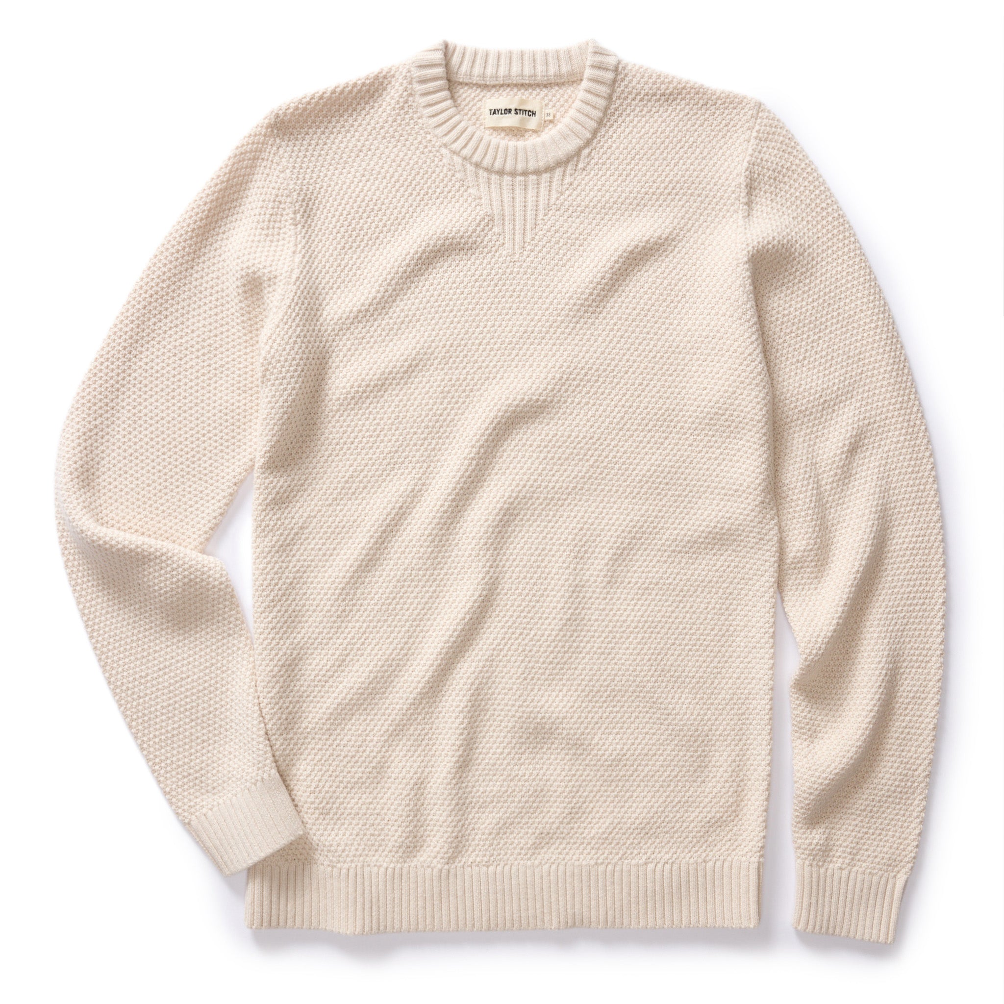 flatlay of The Russell Sweater in Heather Oat, Knits by Taylor Stitch