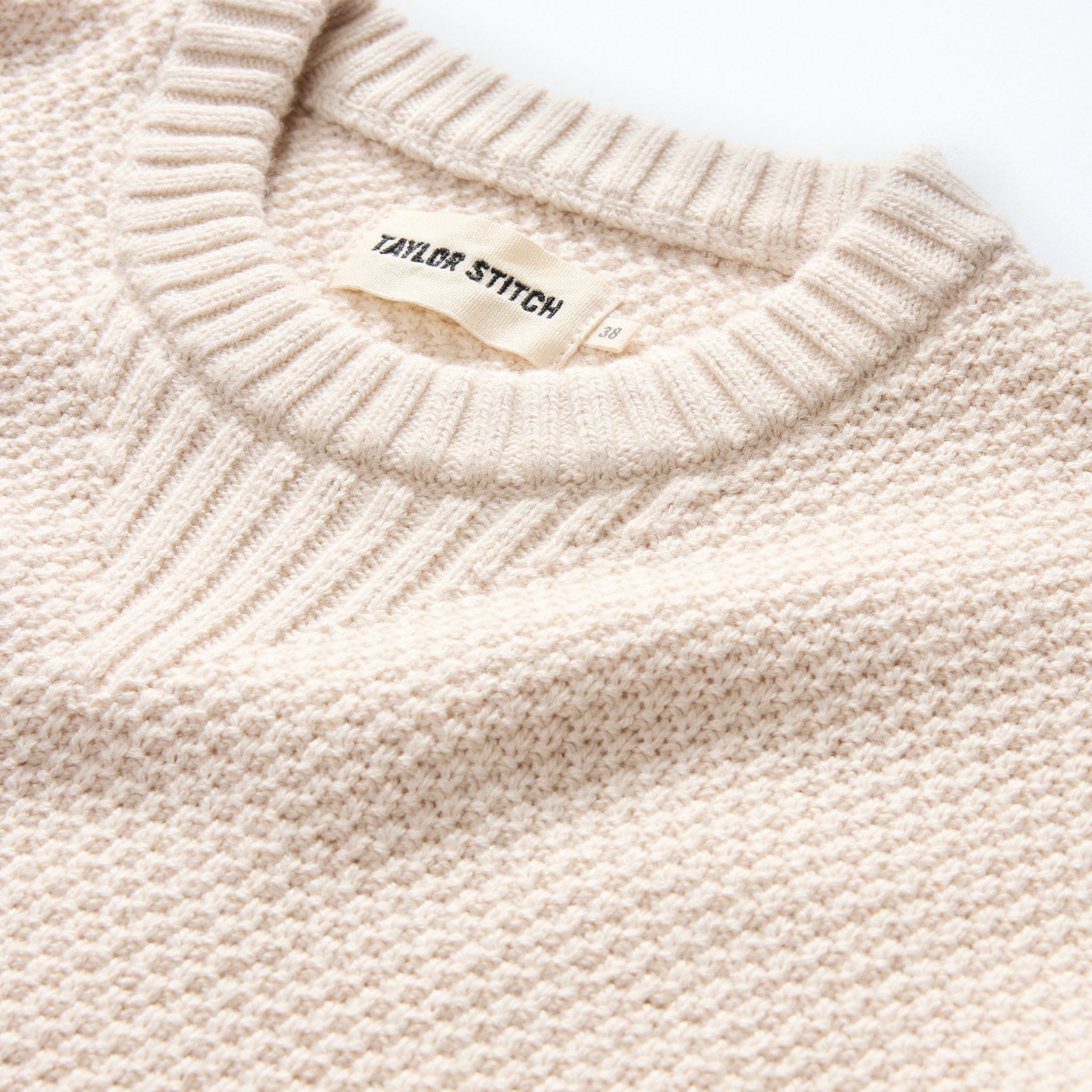 material shot of the collar on The Russell Sweater in Heather Oat, Knits by Taylor Stitch