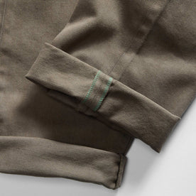 material shot of the selvage cuffs on The Slim All Day Pant in Fatigue Olive Selvage Denim