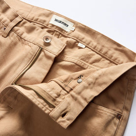 material shot of the waistband on The Slim All Day Pant in Tobacco Selvage Denim