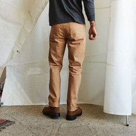 fit model showing off the back of The Slim All Day Pant in Tobacco Selvage Denim