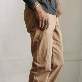 fit model showing the side of The Slim All Day Pant in Tobacco Selvage Denim
