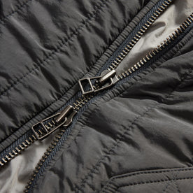 material shot of the two way zipper on The Able Jacket in Faded Black Quilted Nylon