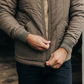 fit model zipping up The Able Jacket in Morel Quilted Nylon