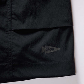 material shot of the tag on The Challenge Cargo Short in Black