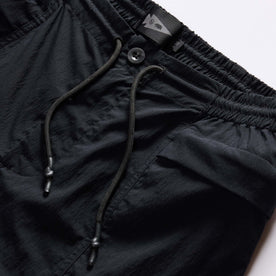material shot of the drawstring on The Challenge Cargo Short in Black