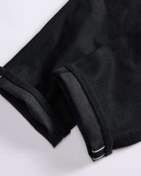 material shot of the cuffs on The Democratic Jean in Black Nihon Menpu Selvage, Bottoms by Taylor Stitch