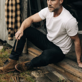 fit model sitting in The Democratic Jean in Black Nihon Menpu Selvage