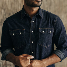 fit model standing in The Frontier Shirt in Rinsed Indigo Denim