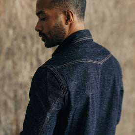 fit model showing the back yoke on The Frontier Shirt in Rinsed Indigo Denim