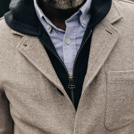 fit model showing the front of The Gibson Jacket in Heathered Oat Nep Herringbone