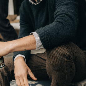 fit model with rolled up sleeves in The Lodge Sweater in Black Pine