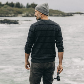 fit model facing the back in The Lodge Sweater in Charcoal Stripe