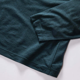 material shot of the sleeves on The Merino Half Zip in Forest