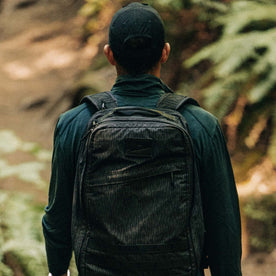 fit model showing off the back of The Merino Half Zip in Forest