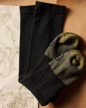 flatlay of The Merino Sock in Black folded, Accessories by Taylor Stitch