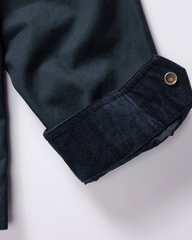 material shot of the corduroy cuffs on The Pathfinder Jacket in Dark Navy Dry Wax, Outerwear by Taylor Stitch