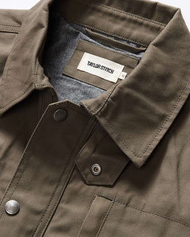 material shot of the collar on The Pathfinder Jacket in Fatigue Olive Dry Wax, Outerwear by Taylor Stitch