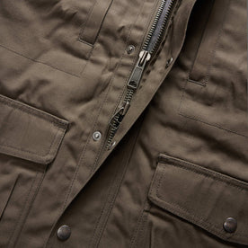material shot of the zipper on The Pathfinder Jacket in Fatigue Olive Dry Wax