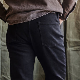 fit model showing the back of The Slim Jean in Black Nihon Menpu Selvage