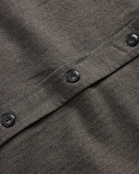 material shot of the button of The Utility Shirt in Olive Broken Herringbone, Wovens by Taylor Stitch