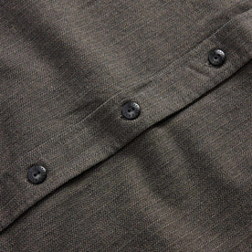 material shot of the button of The Utility Shirt in Olive Broken Herringbone