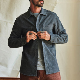fit model buttoning up The Utility Shirt in Navy French Terry Twill Knit