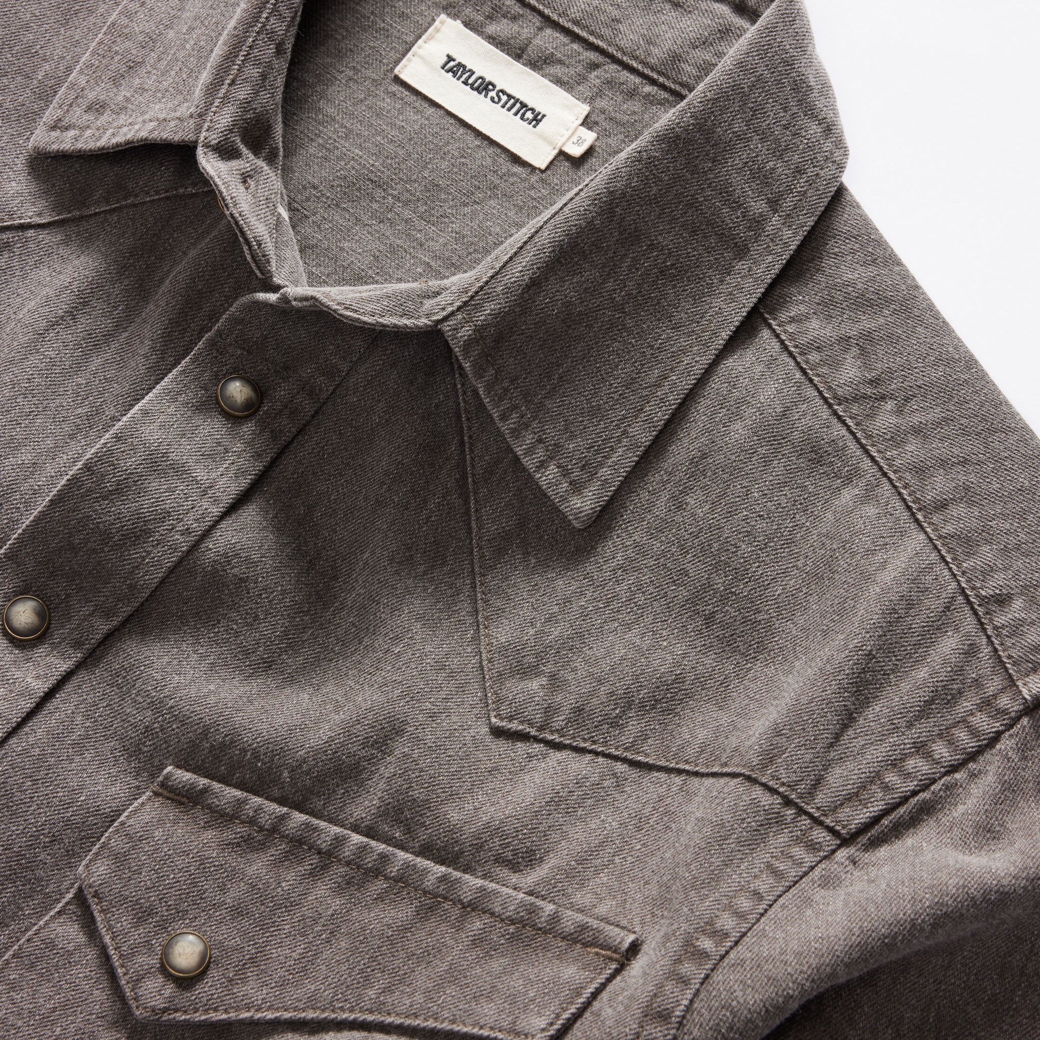 material shot of the collar on The Western Shirt in Soil Pigment Selvage Denim, Wovens by Taylor Stitch