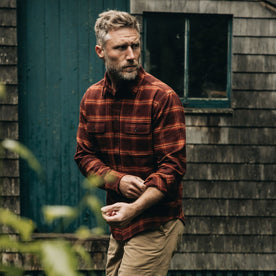 fit model adjusting his sleeves in The Yosemite Shirt in Burnt Toffee Plaid