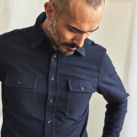 fit model showing the front flap chest pockets on The Yosemite Shirt in Dark Navy