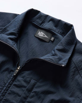 material shot of the collar on The Deploy Packable Shell in Dark Navy, Outerwear by Taylor Stitch