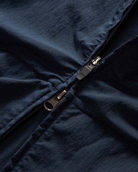material shot of the zipper on The Deploy Packable Shell in Dark Navy, Outerwear by Taylor Stitch
