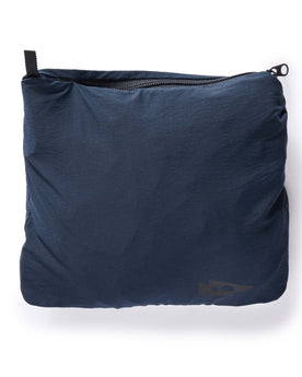 material shot of the small bag that holds The Deploy Packable Shell in Dark Navy, Outerwear by Taylor Stitch