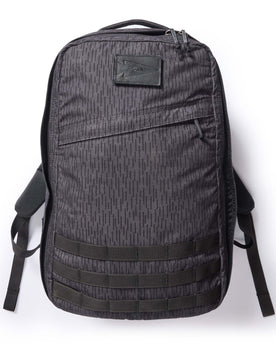 flatlay of The GR1 USA in Raindrop Camo Ripstop WashWax, Accessories by Taylor Stitch