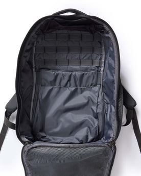 flatlay of the inside of The GR1 USA in Raindrop Camo Ripstop WashWax, Accessories by Taylor Stitch