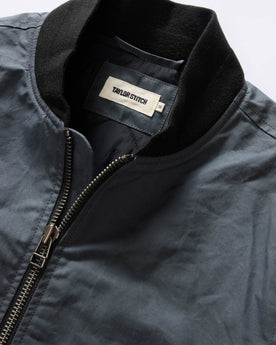 material shot of the ribbed neck on The Bomber Jacket in Charcoal Dry Wax, Outerwear by Taylor Stitch