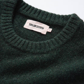 material shot of the ribbed neck opening on The Lodge Sweater in Black Pine