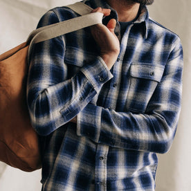 fit model holding a tote in The Ledge Shirt in Blue Sky Plaid